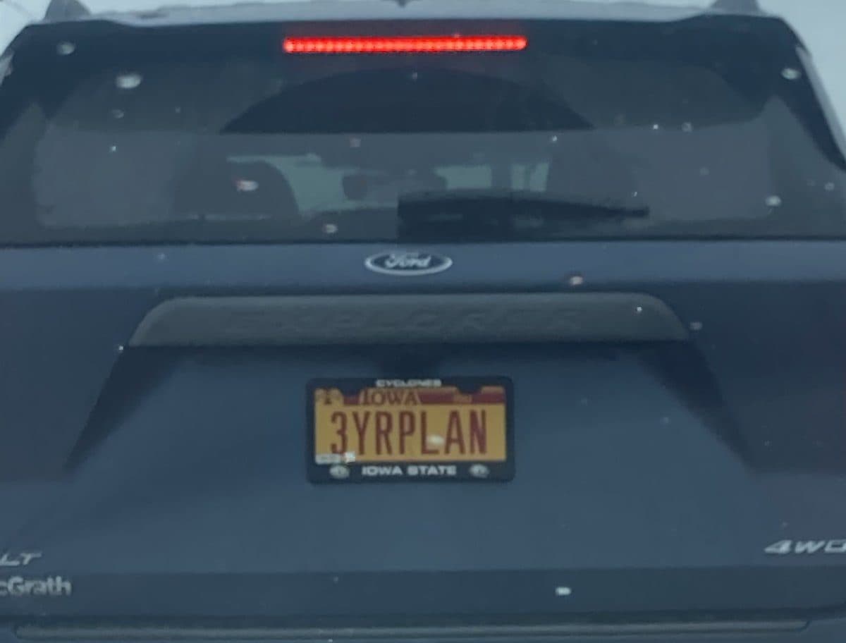 A license plate reading 3YRPLAN on an Iowa State plate
